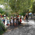 Photo of children under the misting machine.